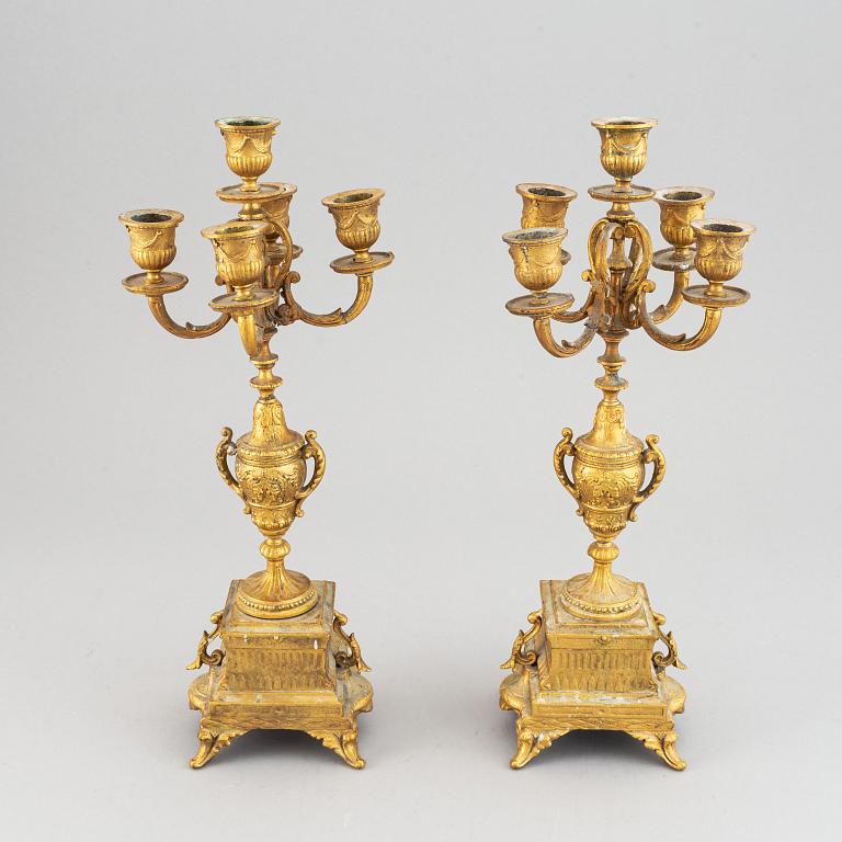 A late 19th century table clock and candelabra, probably France.