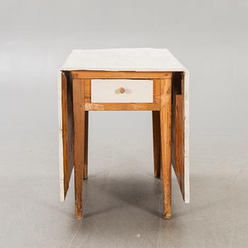 A painted gate legged table later part of the 19th century.