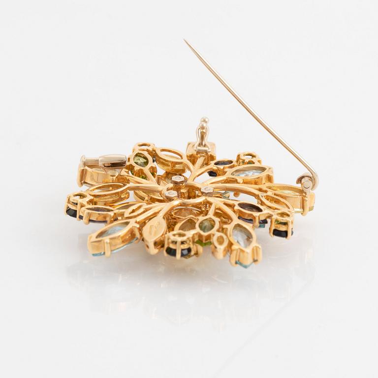 Hänge/brosch 18K guld med fasettslipade ädelstenar.