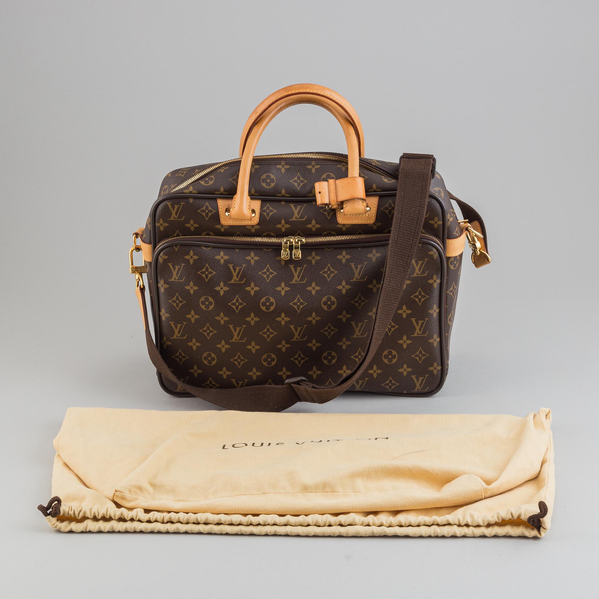 Louis Vuitton, a monogram canvas carry on bag.