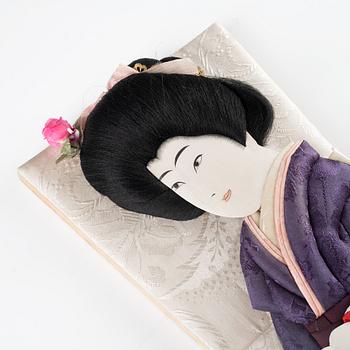 A set of two Japanese hagoita wooden paddles and five shuttlecocks, first part of 20th century.