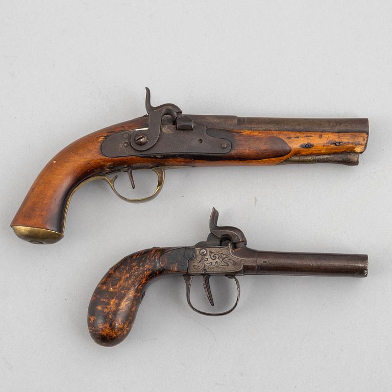 Two 19th century percussion pistols.