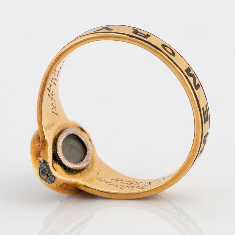 A mourning ring in 18K gold and black enamel set with rose-cut diamonds.