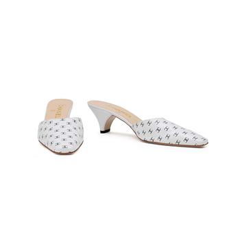 CHANEL, a pair of white leather slip in shoes.