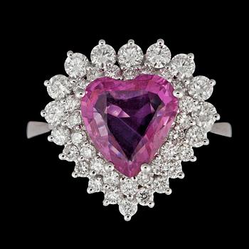 1106. A heart shaped natural pink sapphire, 2,10 cts, and diamonds totally circa 1.12 cts, ring.