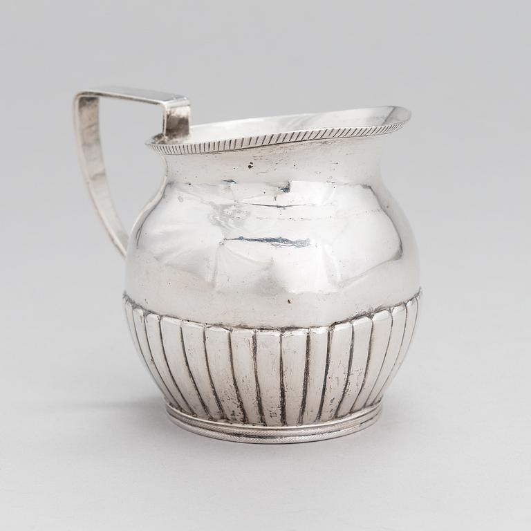 A silver, cream jug, Cyrillic maker's mark Sinkoni, Finland 1824.