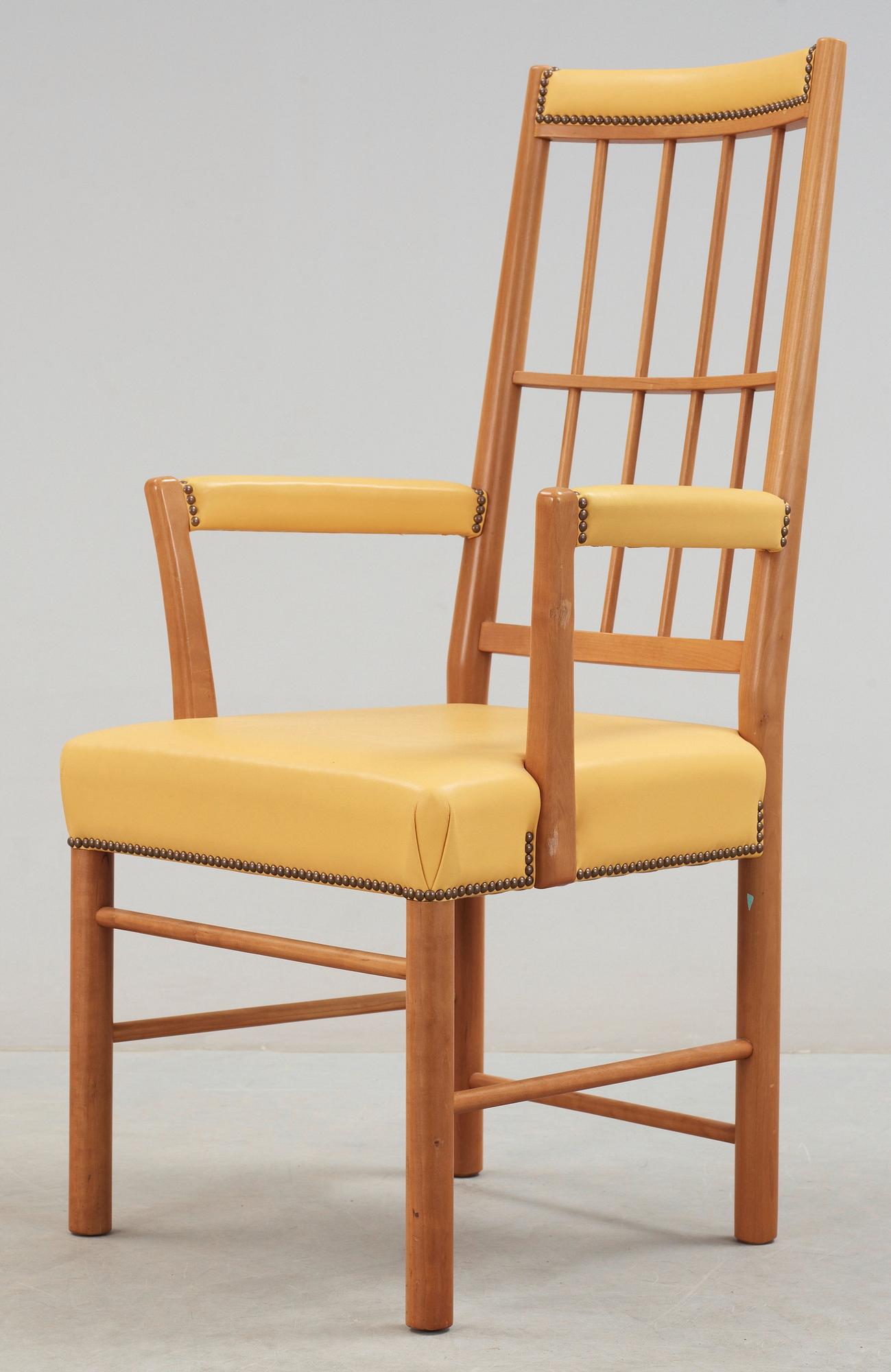 A Josef Frank cherry and yellow leather armchair, Svenskt Tenn, model 652.
