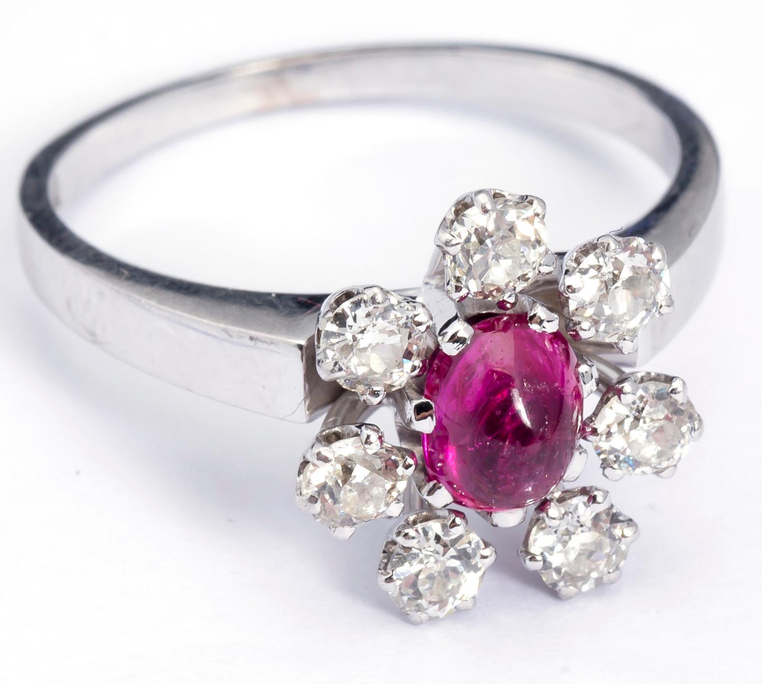 RING, 18 k vitguld, W.A Bolin, Stockholm, 1965, cabochonslipad rubin samt diamanter ca 0.70 ct. Vikt ca 6 g.
