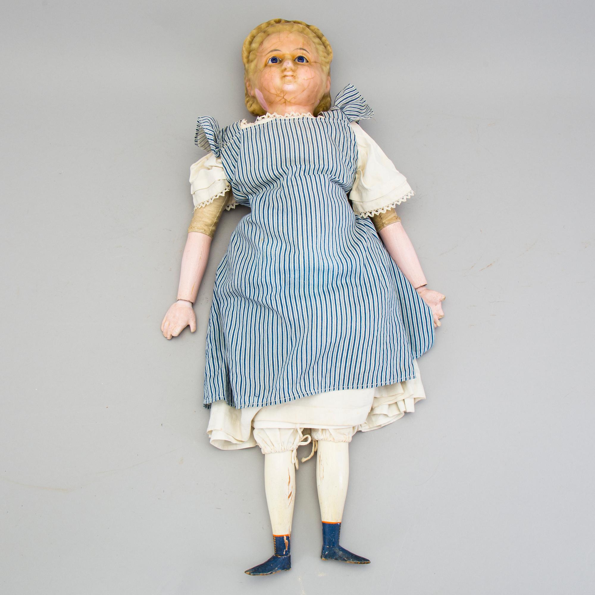 A Wax over papier Mache doll. "Alice in Wonderland". Second half of the 19th century.
