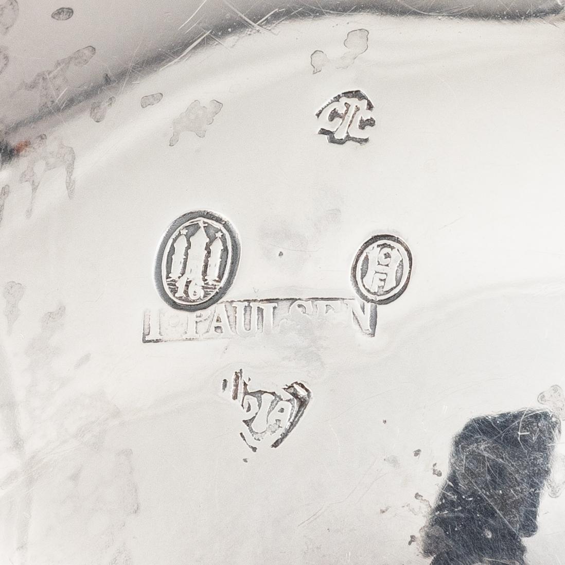 A Danish silver jug and three salt cellars, first half of the 10th Century.