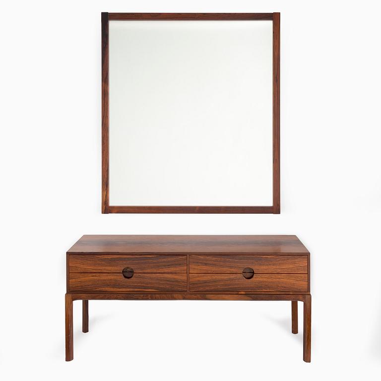 a 1960's mirror with chest of drawer.