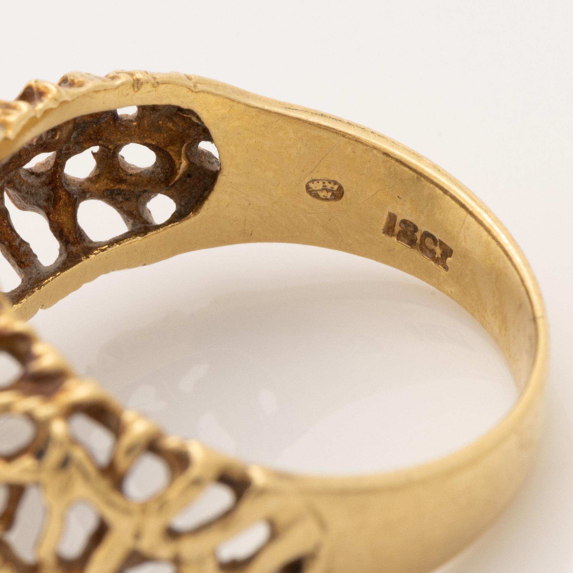 18K gold and brilliant cut diamond and emerald ring.