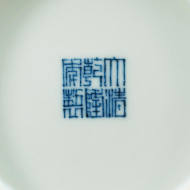 A turkoise ground famille rose dish, Qing dynasty, with Qianlongs seal mark.