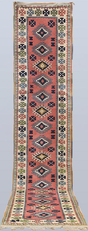 A semi-antique Kars runner, approx. 431 x 95 cm.