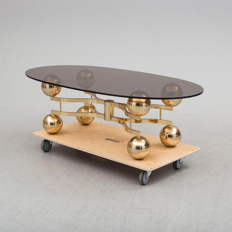 A French 1970s brass and glass coffie table.