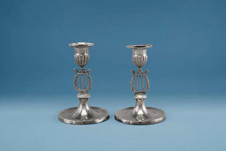 A PAIR OF CANDLE STICKS, silver. Gustaf Holmberg (1826-67) Turku. Led filled. Height 11 cm.