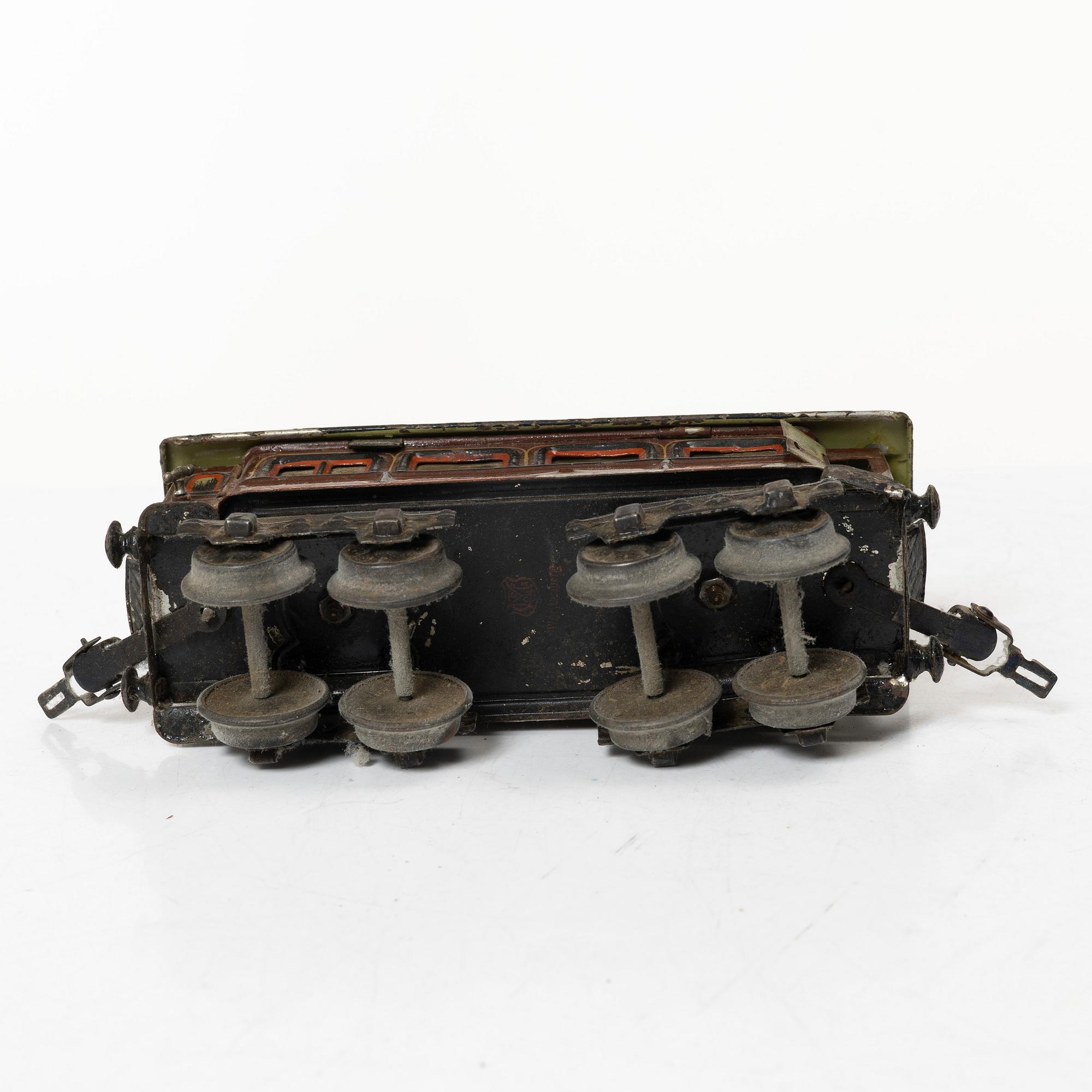 Model train with track and station building, 13 pieces, Germany, 1920s.