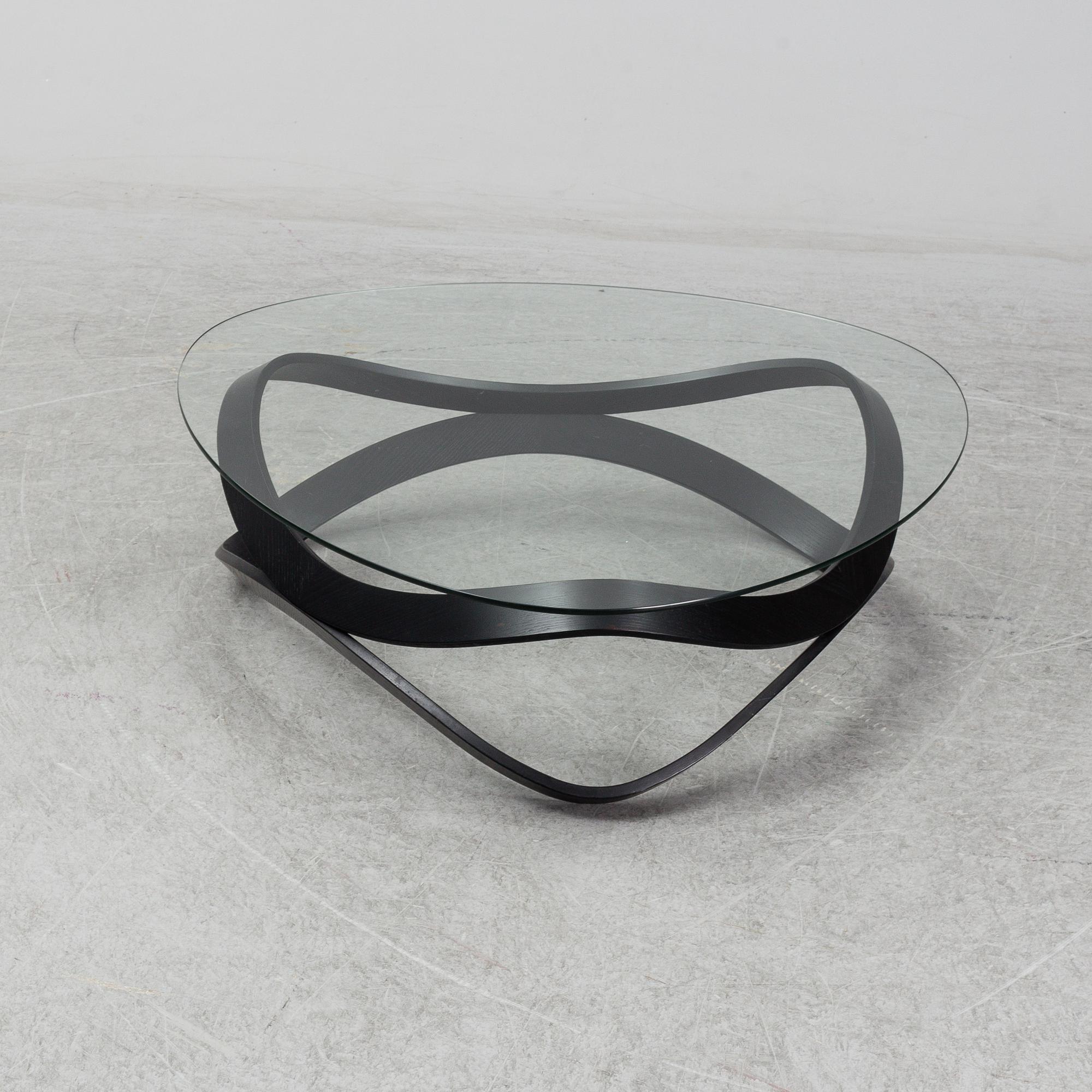 a "Newton" coffee table designed by Dan Sunaga & Staffan Holm in 2009.