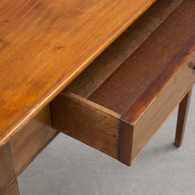 A 19th century mahogany table with drawer.