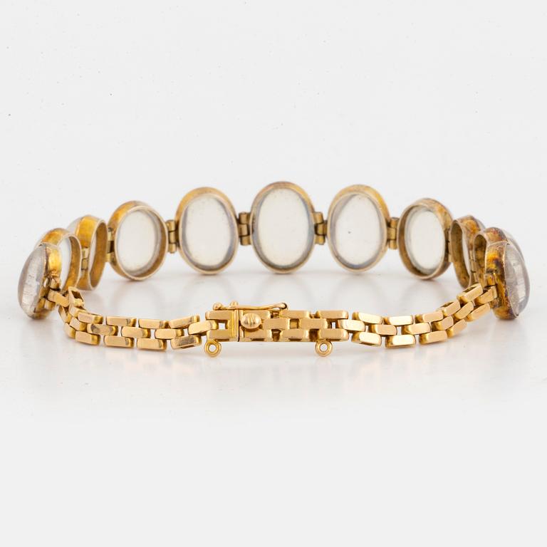 18K gold and cabochon-cut moonstone bracelet.