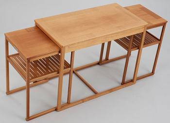 A Carl Malmsten teak set of occasional tables.