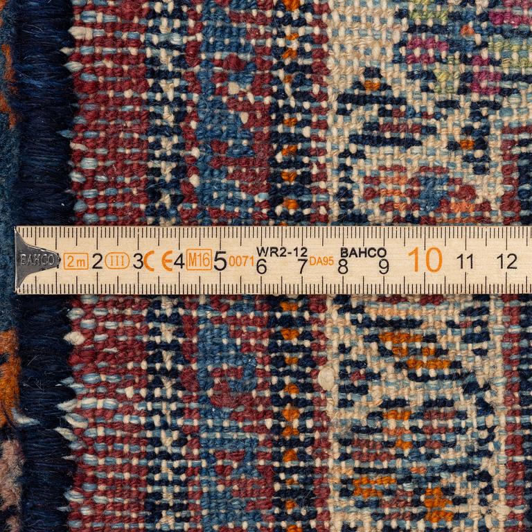 A north-west Persian, semi-antique runner, c. 340 x 110 cm.