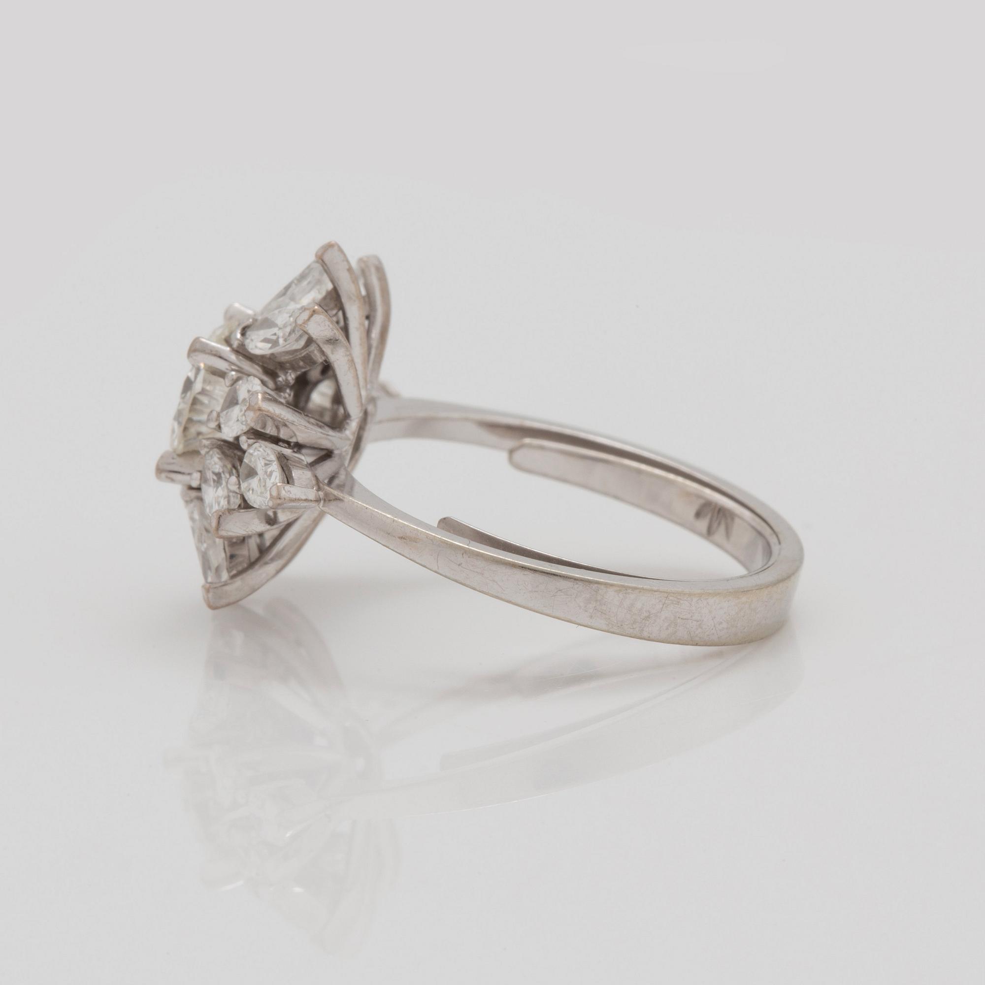 A older brilliant-, marquise-, and pear- cut diamond ring. Center diamond circa 1.20 cts.
