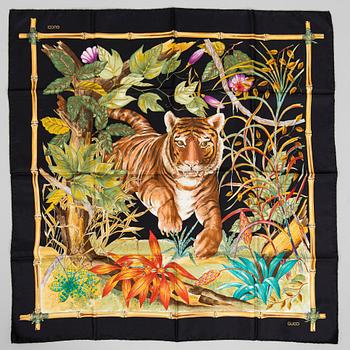 Gucci, a silk scarf.