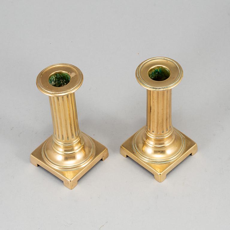 A pair of Louis Seize bronze candlesticks, late 18th century.