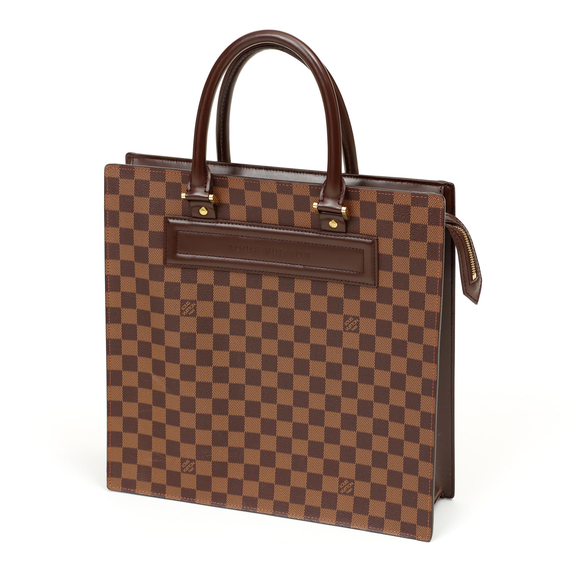A 1990s damier ebene canvas handbag by Louis Vuitton.