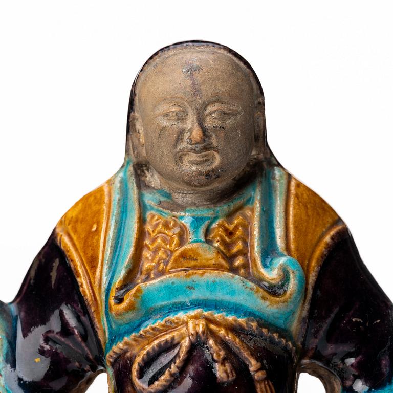 A pottery figure of a the warrior god Guandi, Ming dynasty (1368-1644).