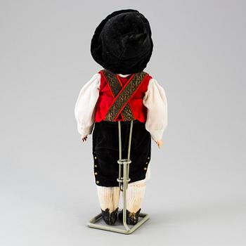 A bisque headed boy doll by Heubach, Germany, 1910s.