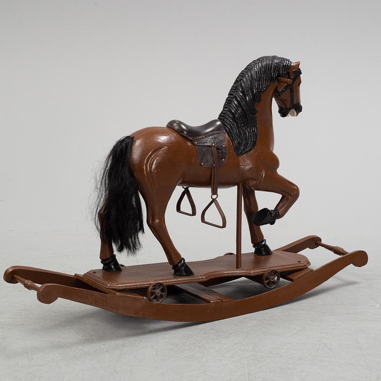 A painted rocking horse from around 1900.