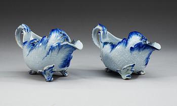 A pair of Swedish Rörstrand faience sauceboats, dated 1/7 (17)65 and 10/8 (17)63.