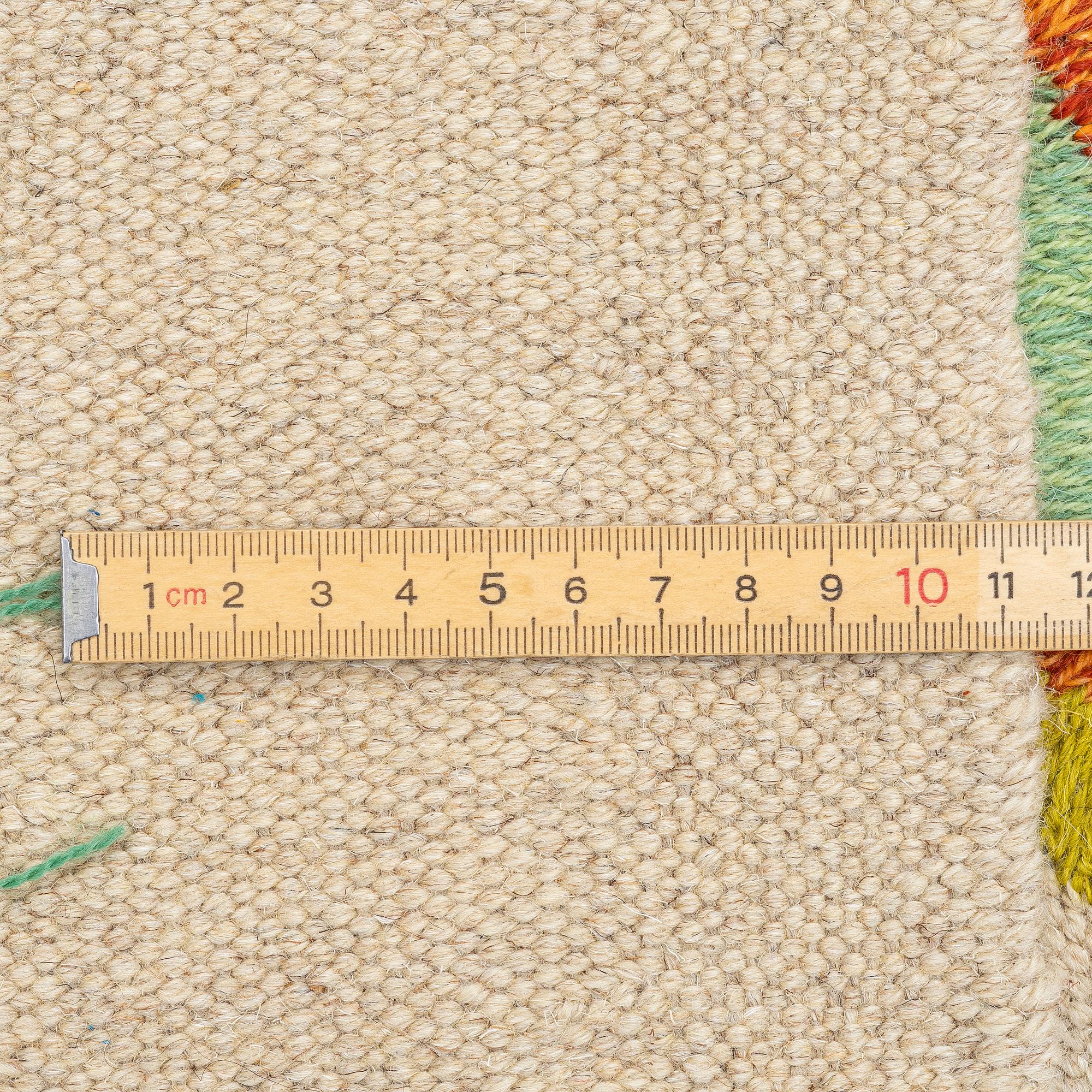 A hand-embroidered Kelim rug, c. 195 x 143 cm.