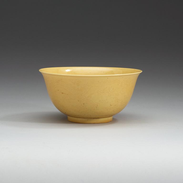 A Chinese yellow glazed bowl, with Kangxi six character mark.