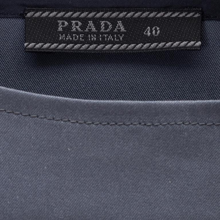 Prada, A dark grey silk-mix skirt and top.