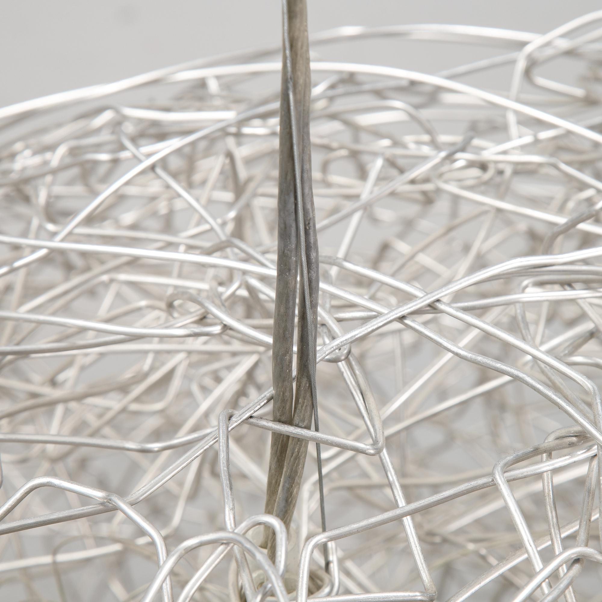 A 'Fil de Fer Ovale' ceiling light by Enzo Cattelini.