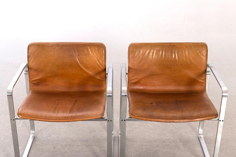 A pair of 20th century second half armchairs by Jörgen Lund & Ole Larsen.