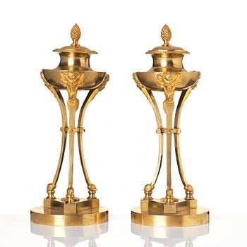 A pair of Empire tripod shaped casolettes.