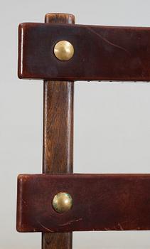A set of five Axel Einar Hjorth 'Funkis' brown leather and stained wood chairs, Nordiska Kompaniet, Sweden ca 1930.