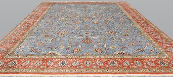 A Ghom carpet, part silk, approx. 480 x 350 cm.