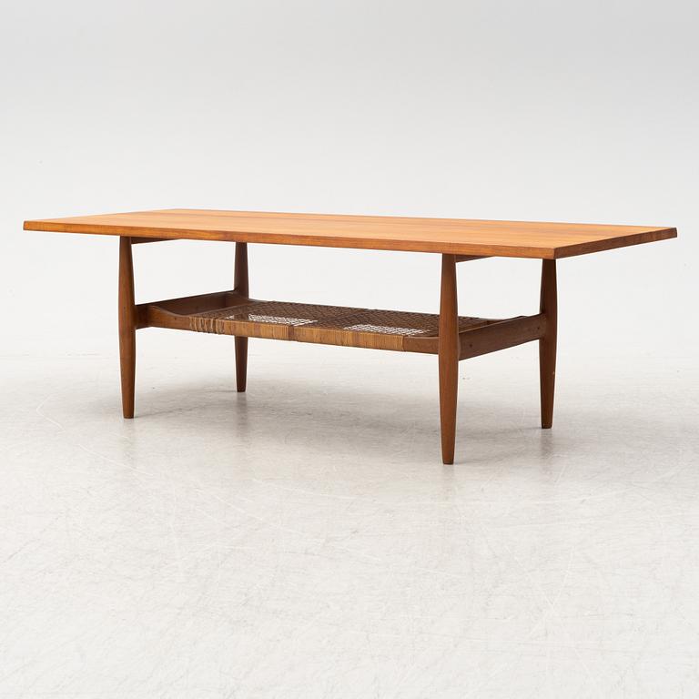 A composite teak coffee table with a rattan shelf, Denmark, 1950/60s.