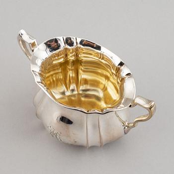 A swedish parcel-gilt coffee pot, creamer and suga bowl.