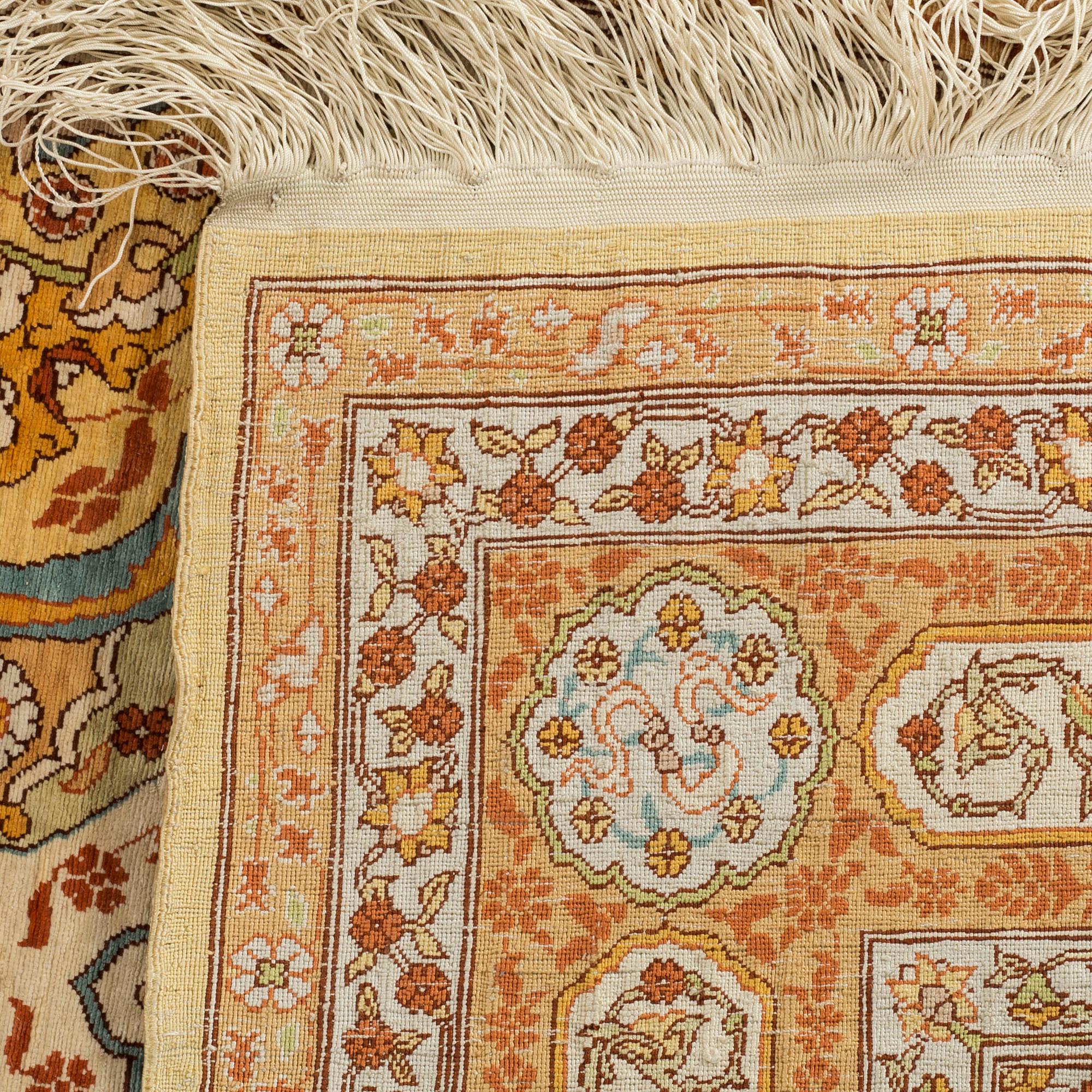 An old/semiantique Hereke silk carpet ca 77 x 53 cm.