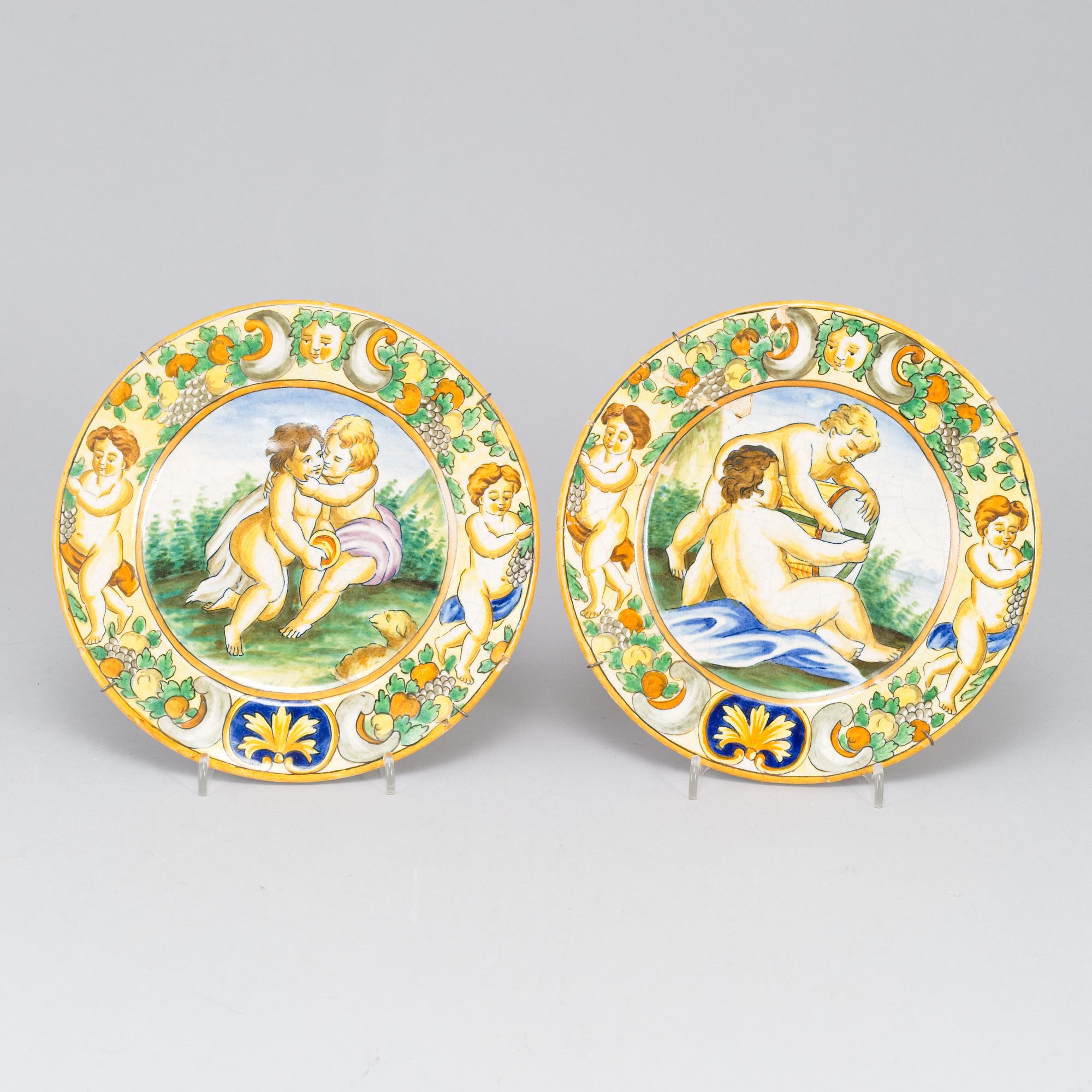 A large majolica 'istoriato' dish and two plates, 20th Century.