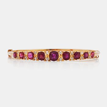 565. An old cut diamond and ruby bracelet. Total carat weight of diamonds circa 0.30 ct.