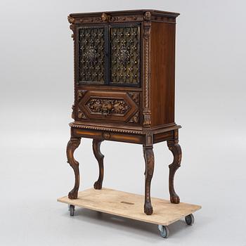 A Baroque style drinks cabinet, first half of the 20th Century.