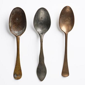 A set of three brass spoons, 18th century.