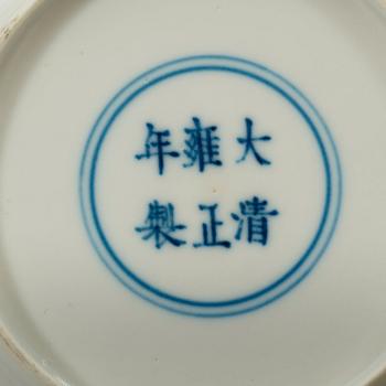 A pair of white-glazed small moulded dishes, Qing dynasty, Yongzheng six-character mark and of the period.